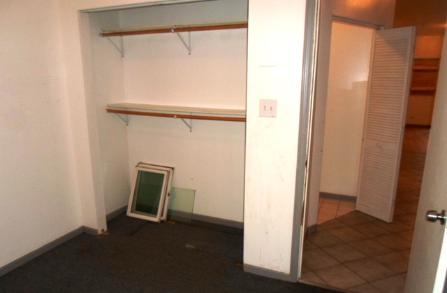 2236 West 47th Place Chicago, IL 60609 - Photo 5 of 18 a view of room with a door and a window