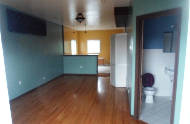 2236 West 47th Place Chicago, IL 60609 - Photo 9 of 18 a view of an empty room and wooden floor