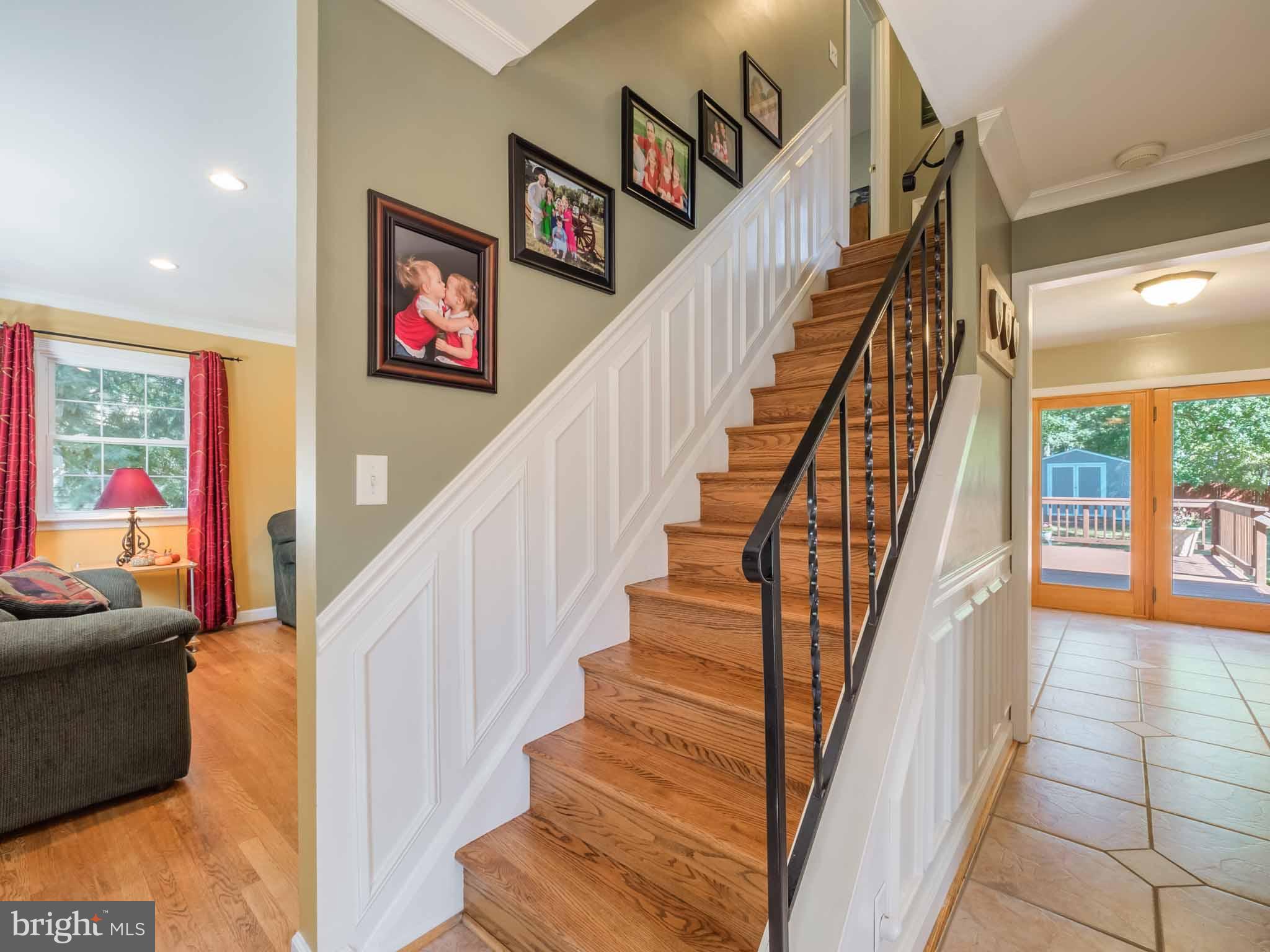 814 Danza Road Severn, MD 21144 - Photo 12 of 30 Stairway to upper level and living room