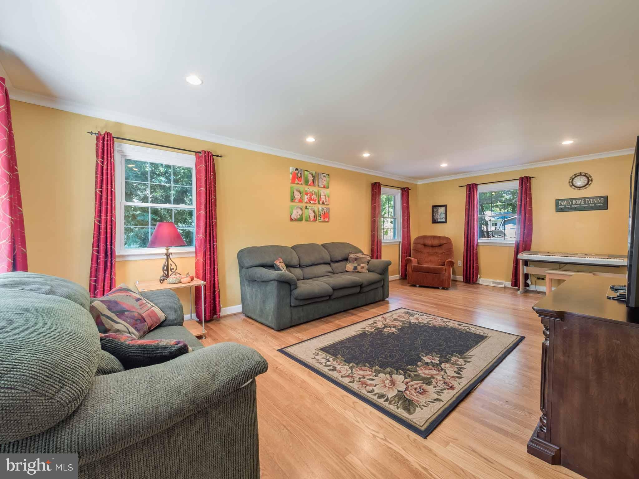 814 Danza Road Severn, MD 21144 - Photo 13 of 30 Spacious living room with hardwood flooring