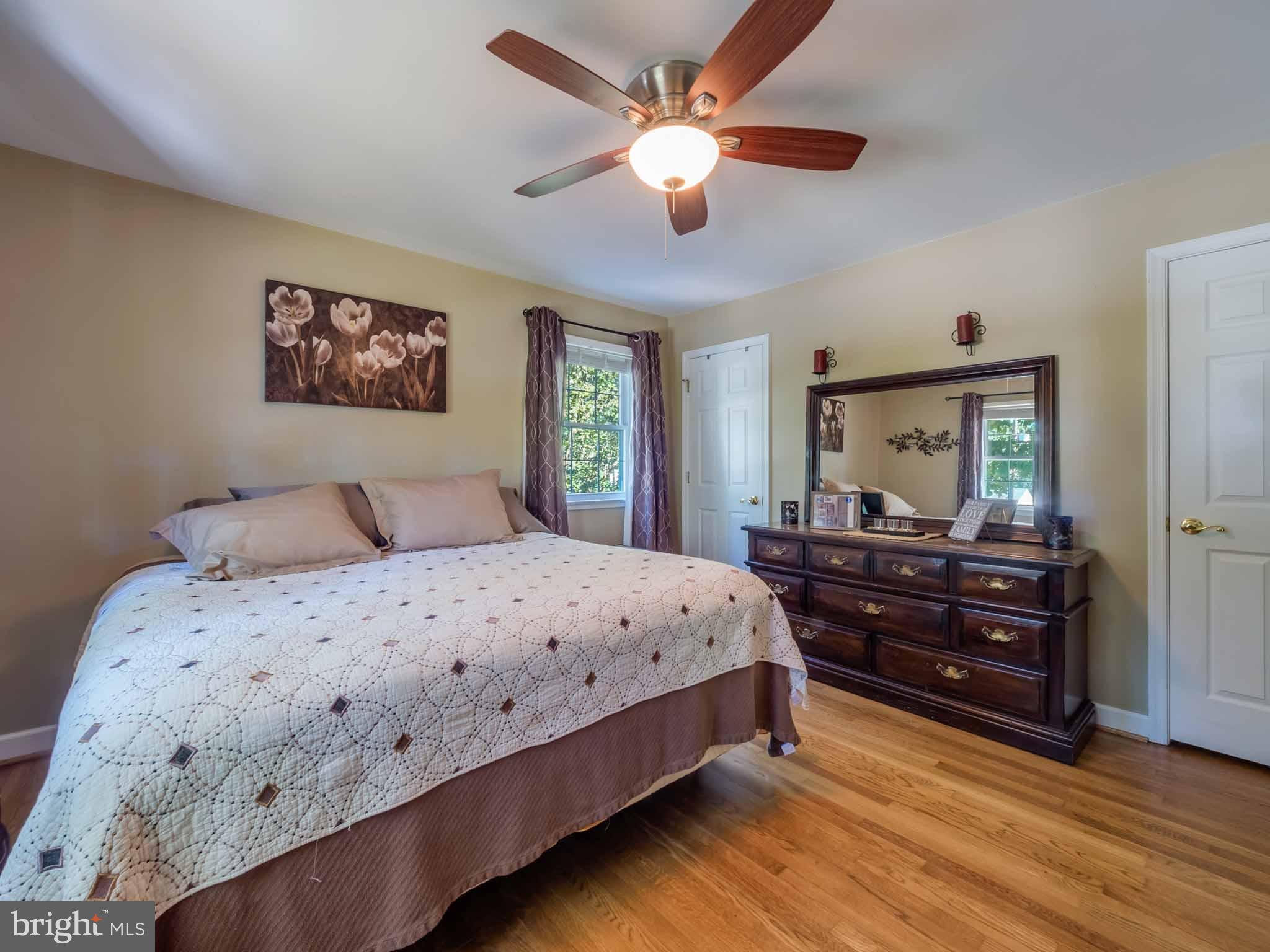 814 Danza Road Severn, MD 21144 - Photo 21 of 30 Hardwood flooring and lighted ceiling fan