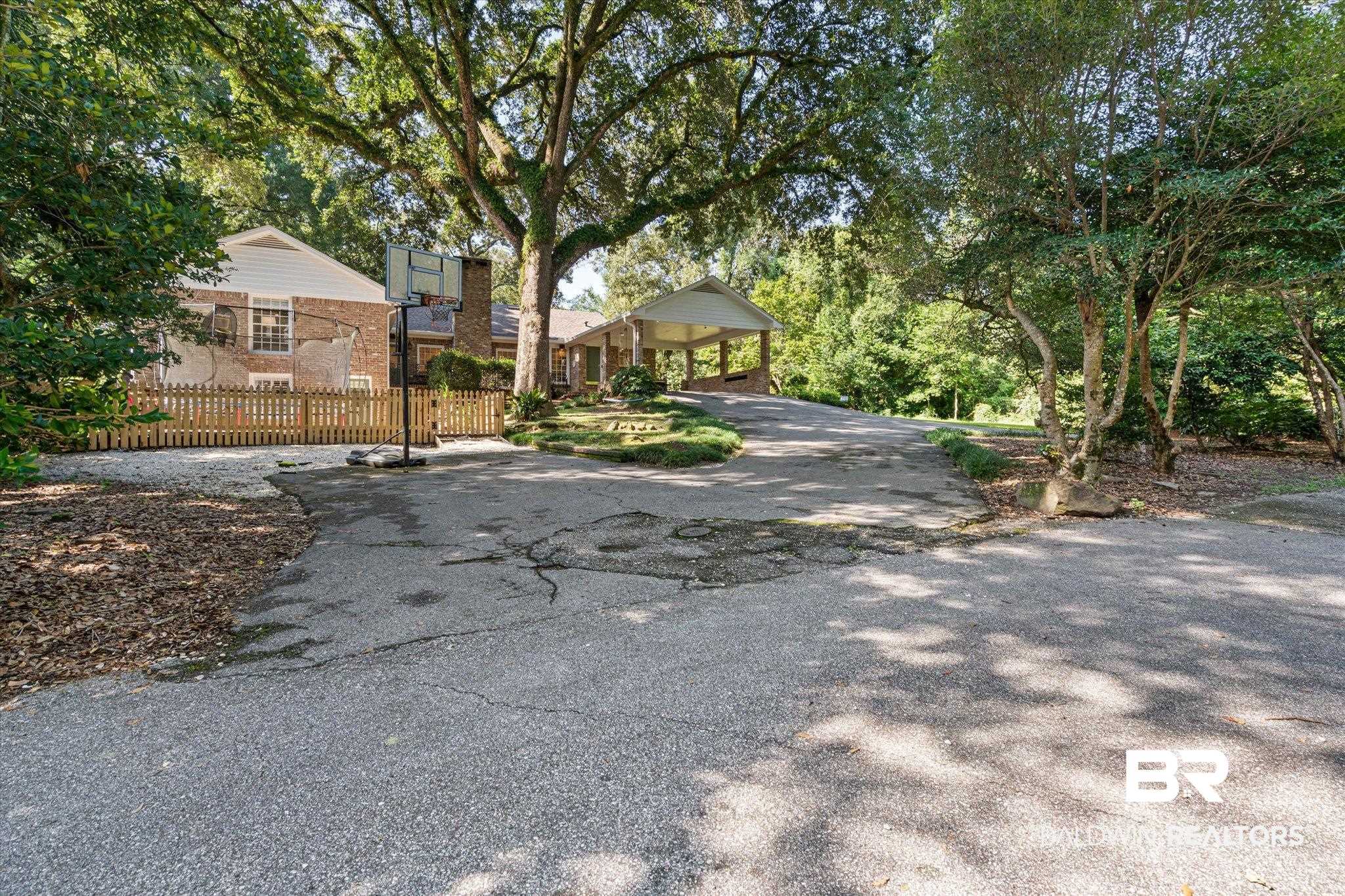 3612 Linden Lane Mobile, AL 36608 - Photo 39 of 42 View of front of property with driveway and a chimney