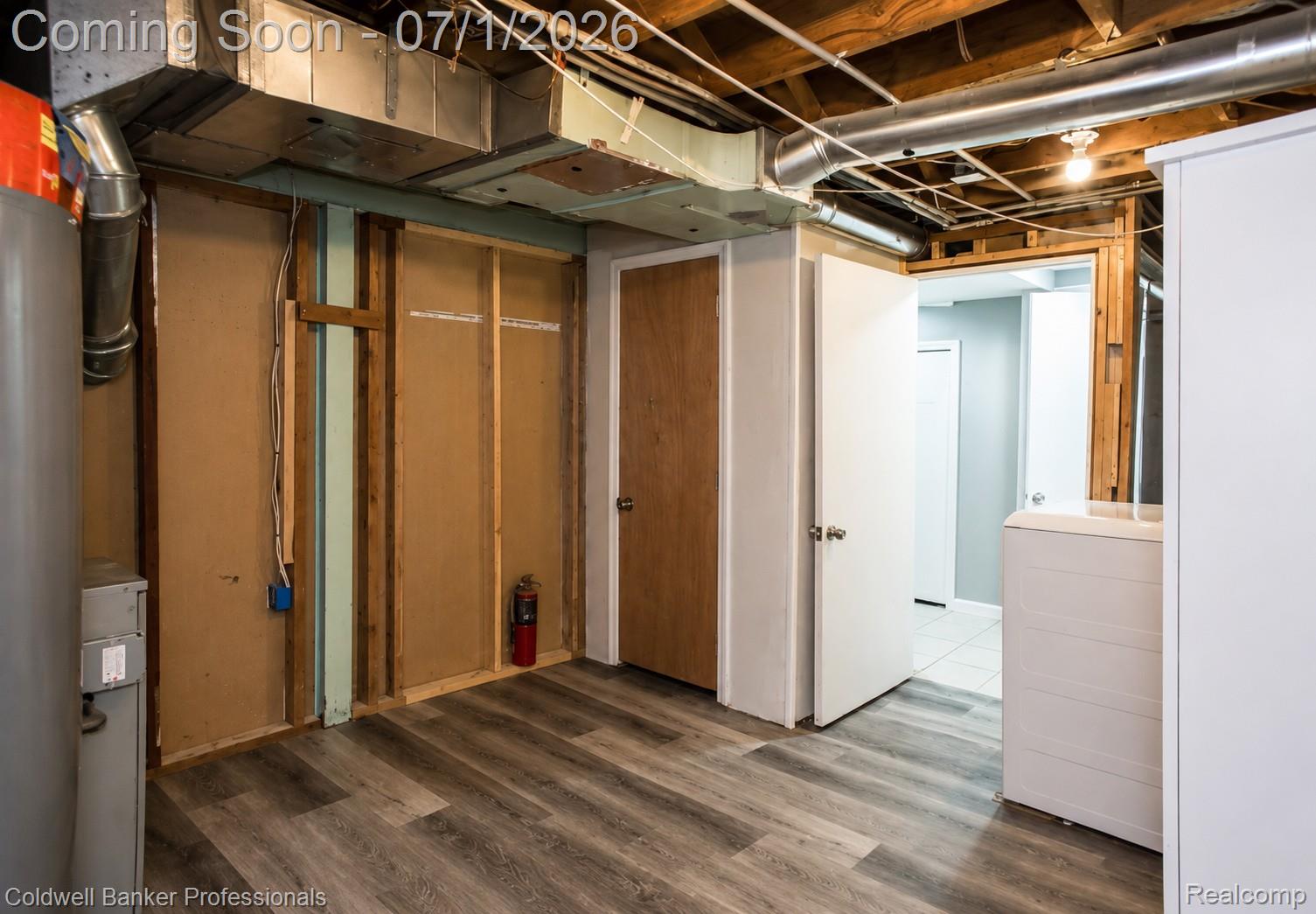 1168 Vernier Road Grosse Pointe, MI 48236 - Photo 29 of 32 Basement area featuring wood-finish flooring and exposed ceiling joists