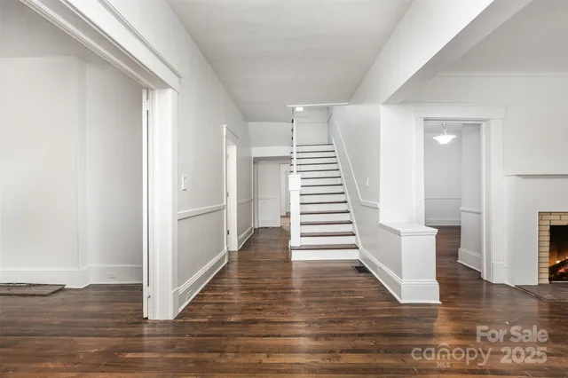 a view of an entryway with wooden floor