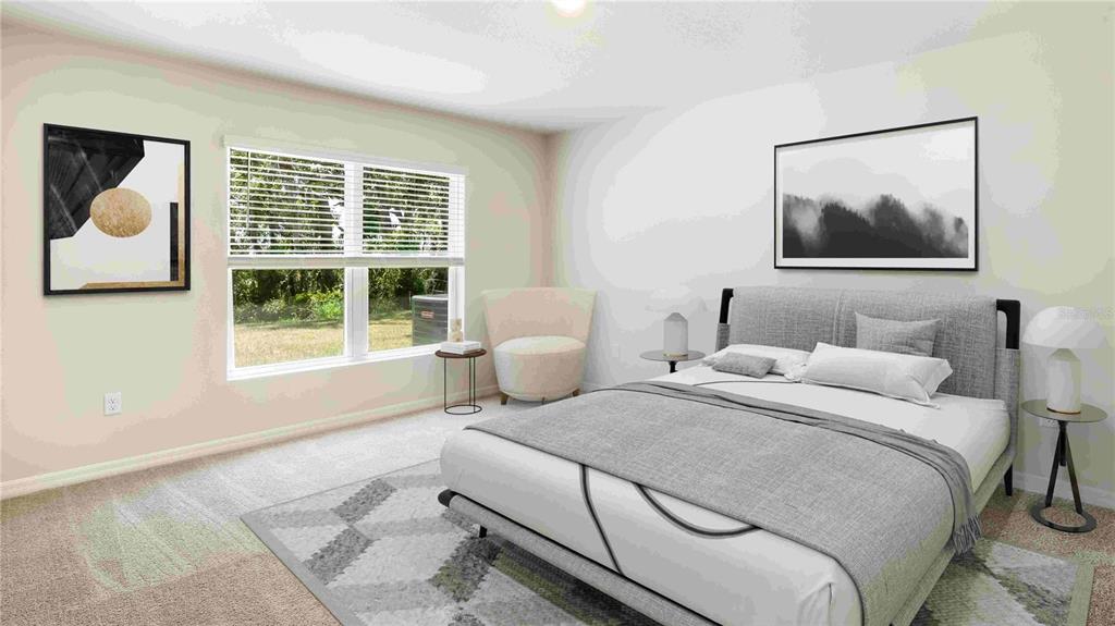 10931 Rabbit Grove Trail Palmetto, FL 34221 - Photo 10 of 30 a bedroom with a bed and glass window