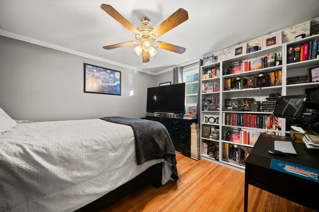 a bed room with a bed and a book shelf