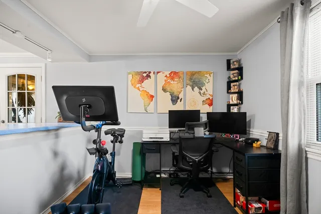 a living room with furniture and a book shelf