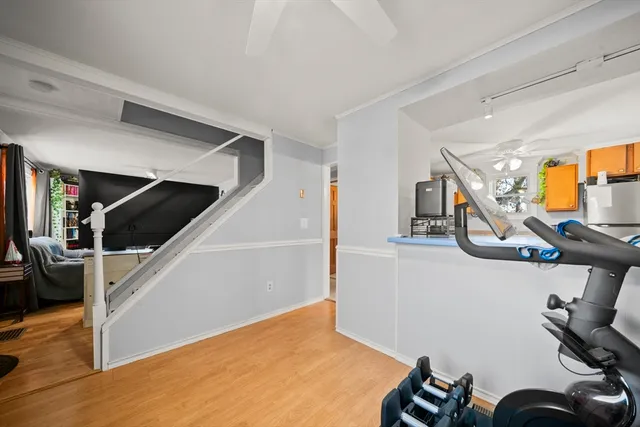 a bedroom with a bed and a book shelf