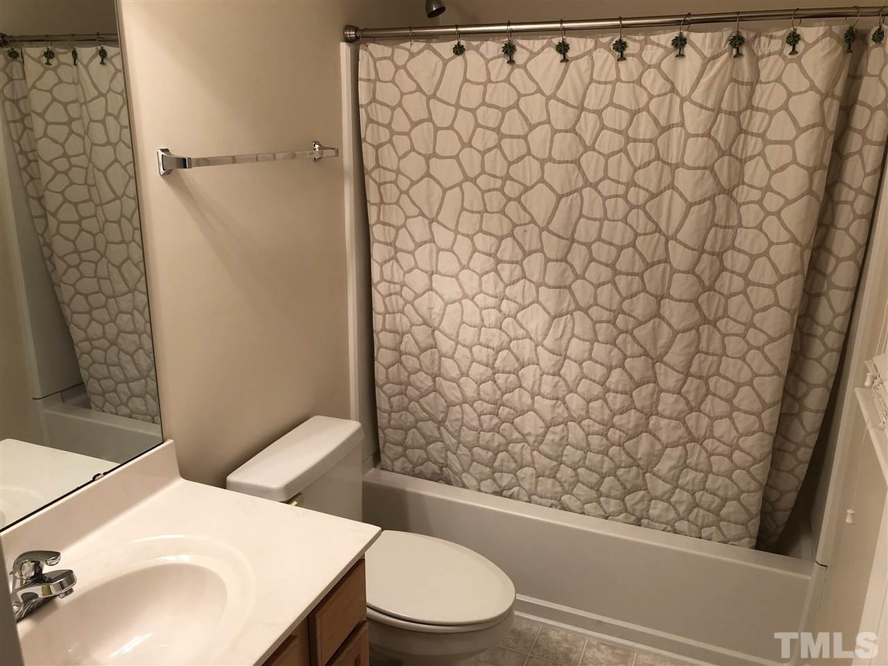 5426 Goldenglow Way Raleigh, NC 27606 - Photo 20 of 25 a bathroom with a sink and a toilet