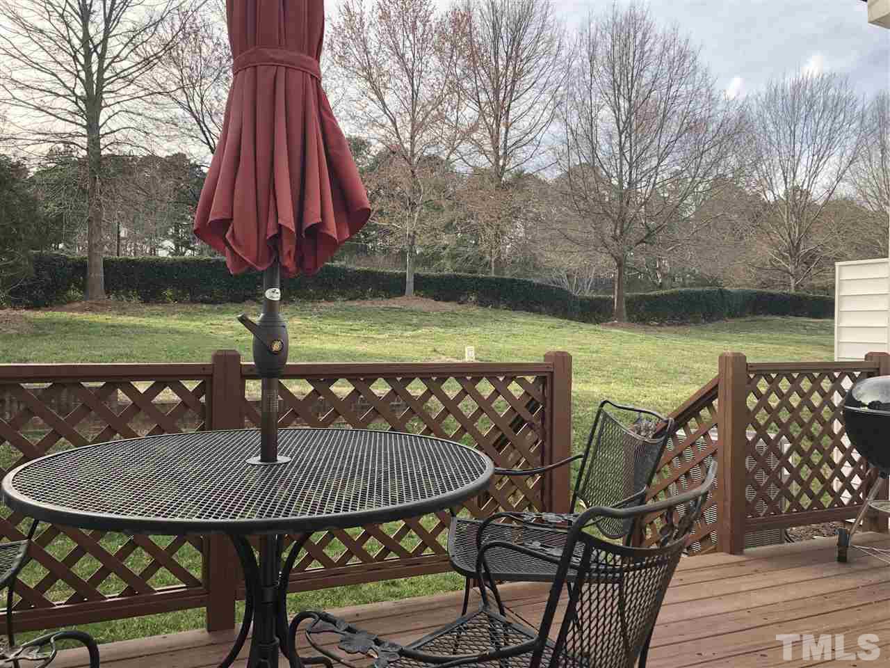 5426 Goldenglow Way Raleigh, NC 27606 - Photo 25 of 25 a view of a table and chairs on the roof deck