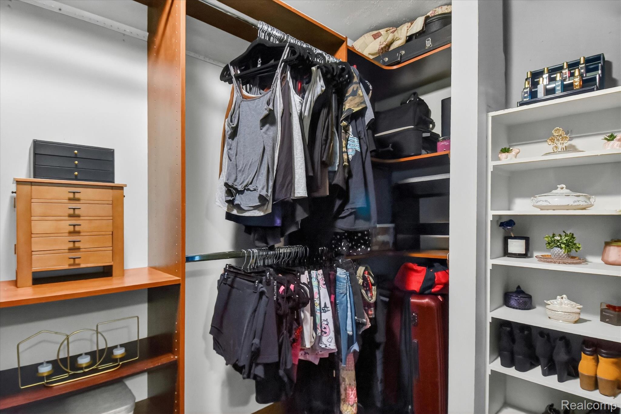 3949 West Burns Line Road Brown City, MI 48416 - Photo 27 of 70 Custom closet system featuring wood-finish shelving and built-in hanging rods