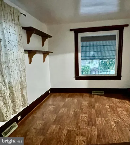 a view of a room with rack and window