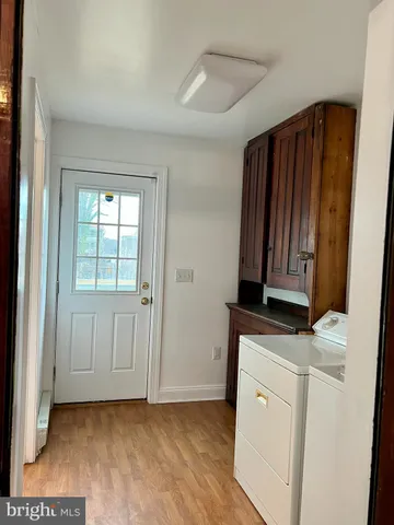 a view of hallway with washer and dryer