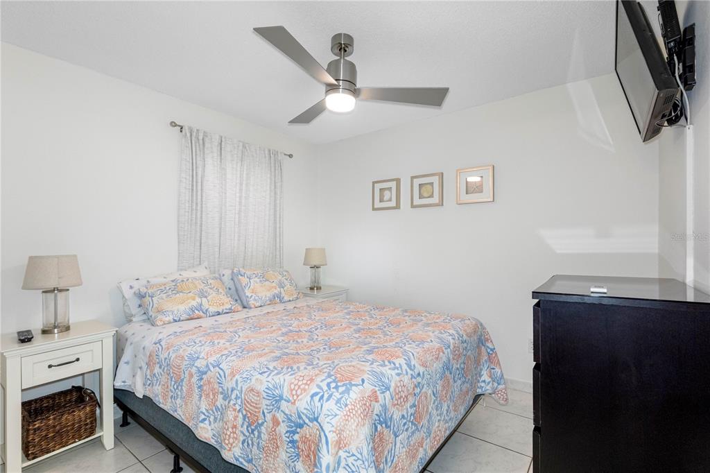 614 Gulf Boulevard, Unit 9 Indian Rocks Beach, FL 33785 - Photo 25 of 41 a bedroom with a bed and a window