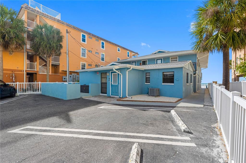 614 Gulf Boulevard, Unit 9 Indian Rocks Beach, FL 33785 - Photo 4 of 41 front view of a house with a yard