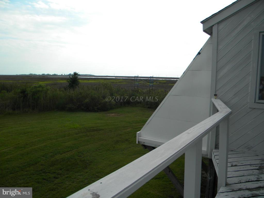 3951 Tyler Road Ewell, MD 21824 - Photo 14 of 17 a view of a balcony with an outdoor space