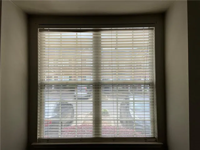 a view of a room that has a large window