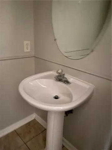 a bathroom with a sink and mirror