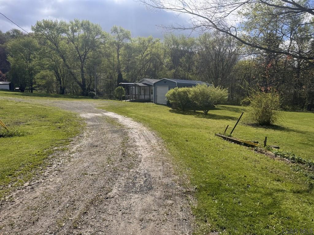 127 1st Street Twin Rocks, PA 15960 - Photo 8 of 20 a backyard of a house with lots of green space