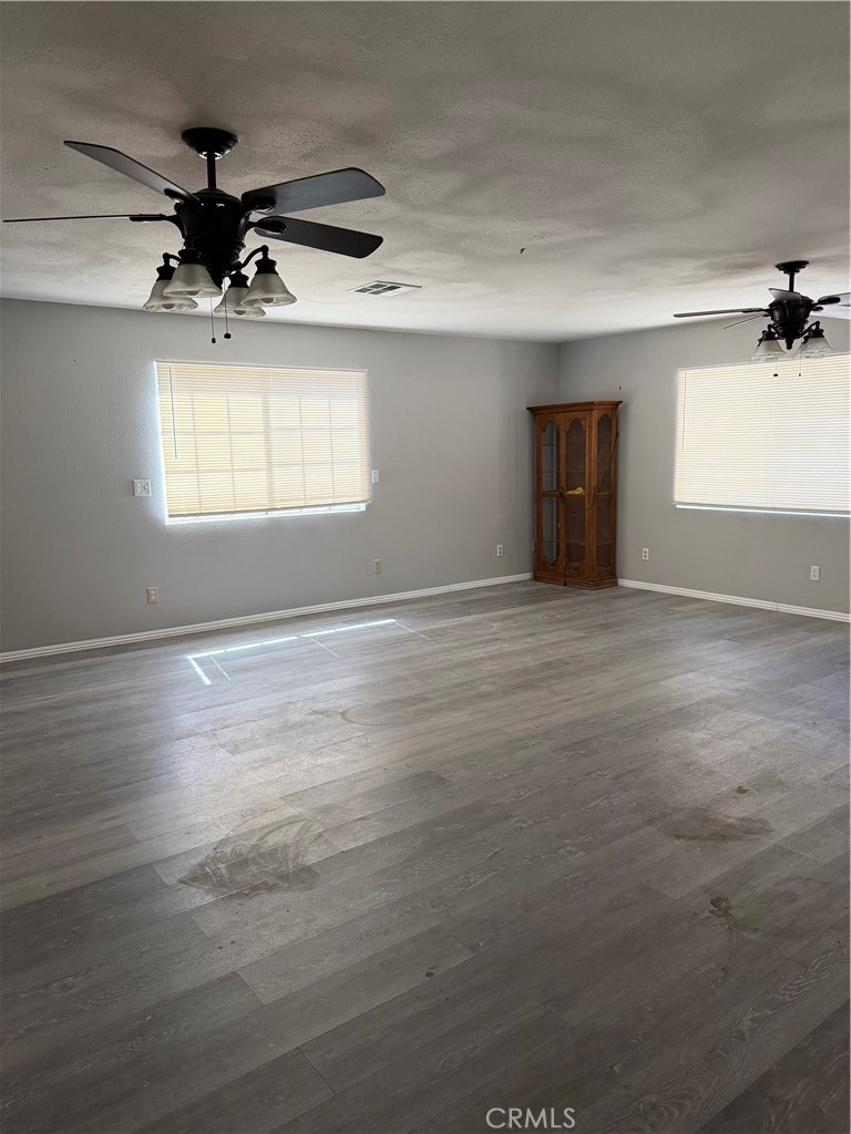 18602 Cocqui Road Apple Valley, CA 92307 - Photo 8 of 16 a view of an empty room and a window