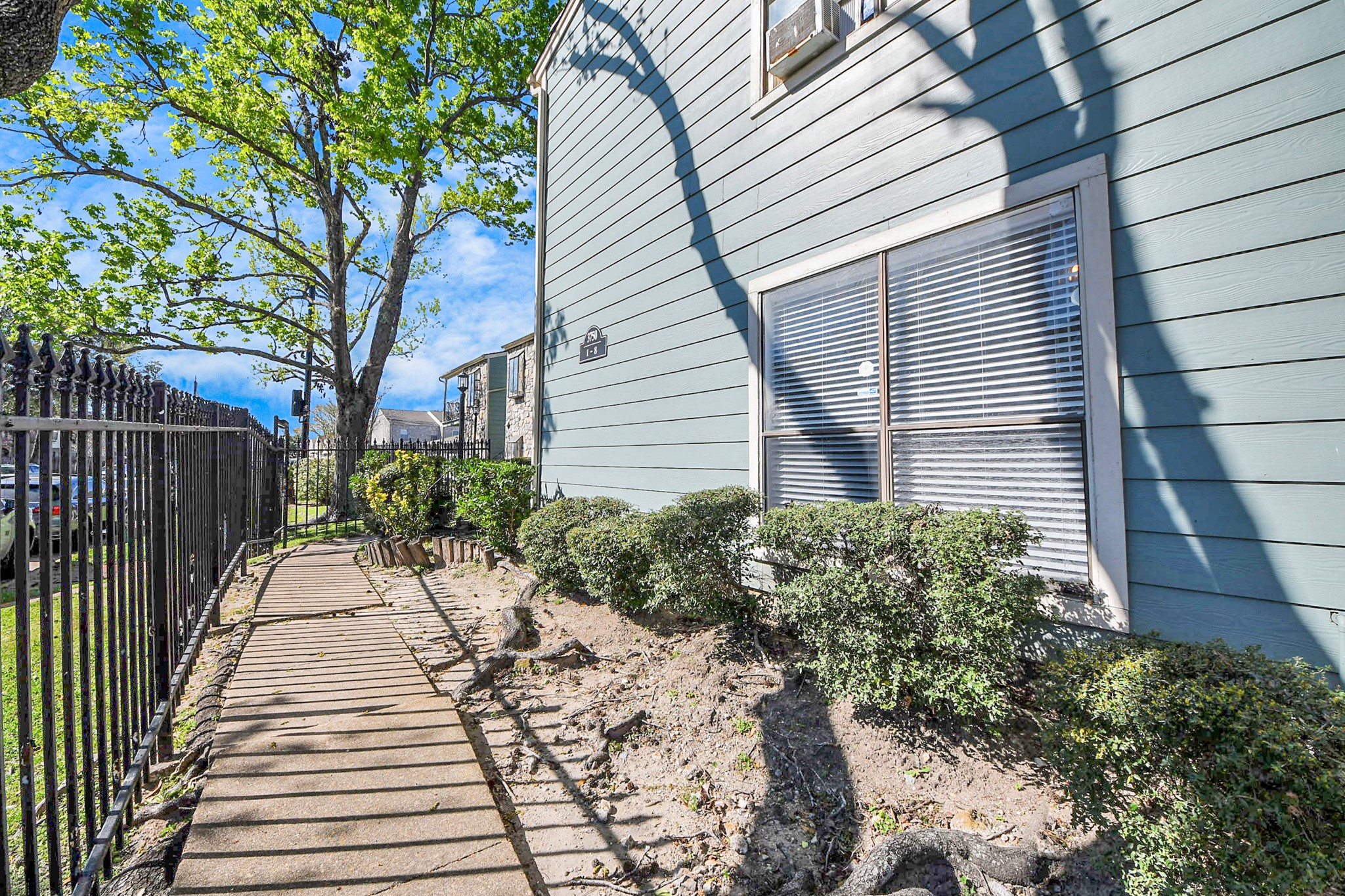 3750 Tanglewilde Street, Unit A7 Houston, TX 77063 - Photo 5 of 41 a view of a pathway with a house