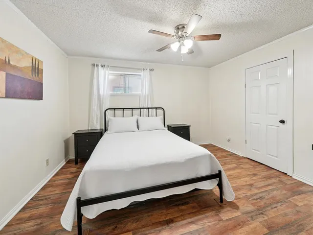 a bedroom with a bed and window