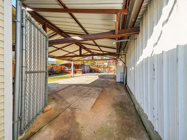 a view of a porch with wooden floor