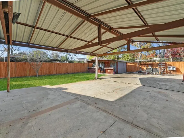 a view of a backyard with a barn