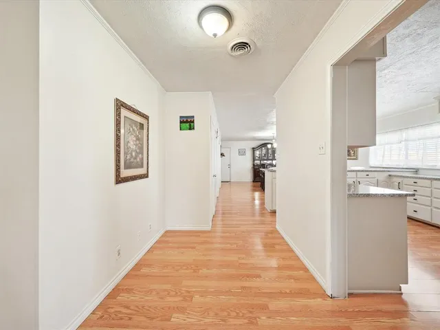 a view of a living room with wooden floor