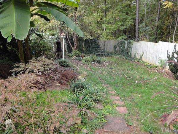 8016 Millenium Drive Raleigh, NC 27614 - Photo 22 of 25 Grassy area has a small koi pond. View from back porch.