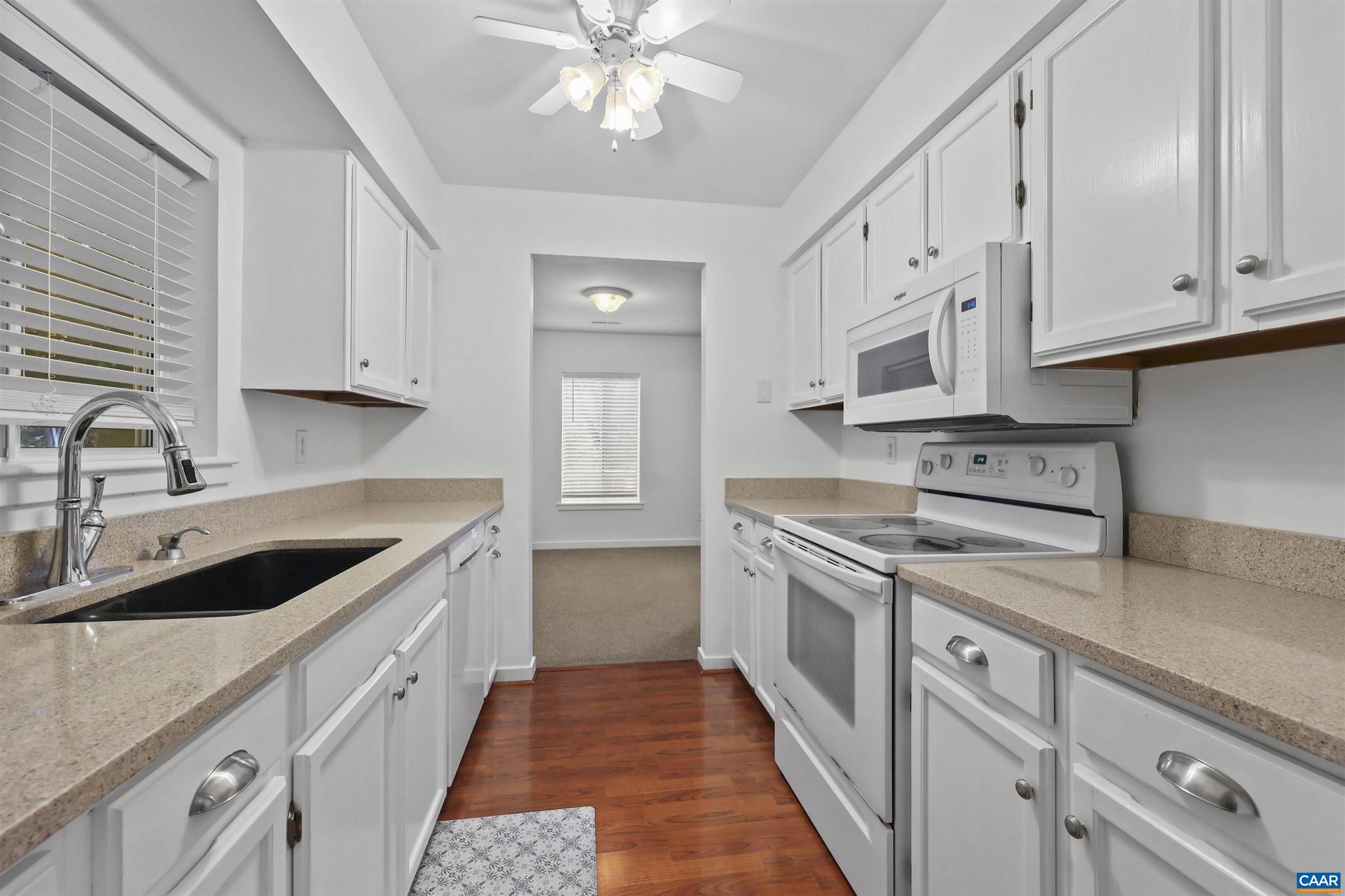 1250 Maple View Drive Charlottesville, VA 22902 - Photo 8 of 25 a kitchen with stainless steel appliances granite countertop white cabinets sink and dishwasher