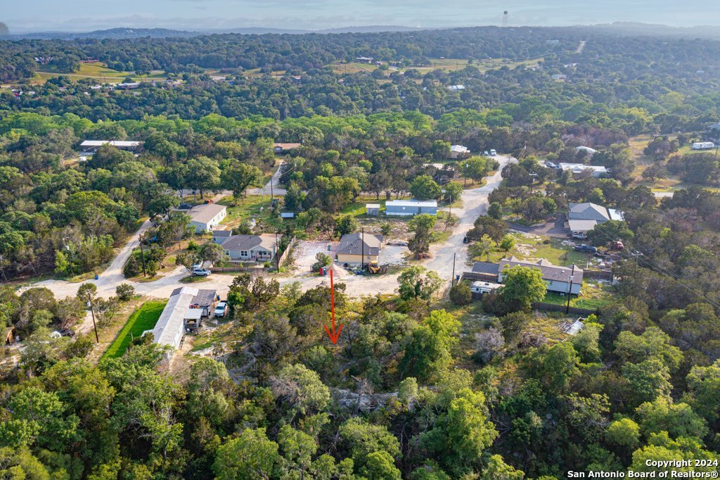 248 Wren Circle Spring Branch, TX 78070 - Photo 8 of 8 an aerial view of house with yard and mountain view in back