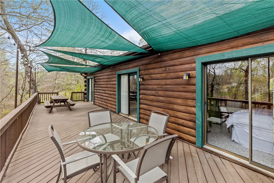 203 Little Lane Seneca, SC 29672 - Photo 19 of 48 This spacious wooden deck offers an inviting outdoor retreat with ample room for entertaining.