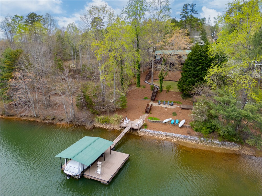 203 Little Lane Seneca, SC 29672 - Photo 2 of 48 This serene waterfront property offers direct lake access with a private dock and lush surroundings.