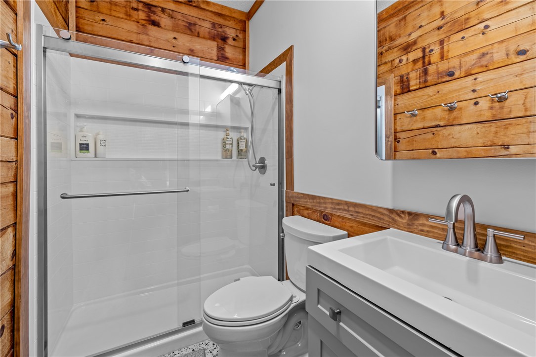 203 Little Lane Seneca, SC 29672 - Photo 24 of 48 This bathroom features a contemporary shower with a glass enclosure and a stylish vanity.
