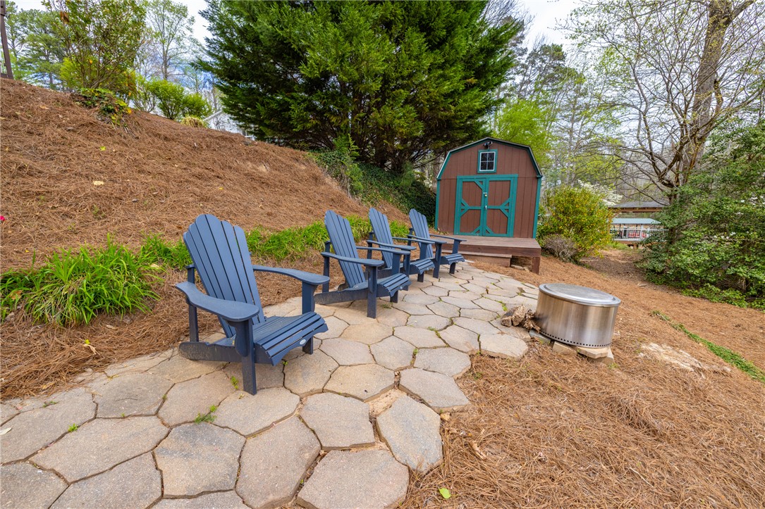 203 Little Lane Seneca, SC 29672 - Photo 35 of 48 This serene outdoor space offers a perfect retreat for relaxation and enjoying the natural surroundings.