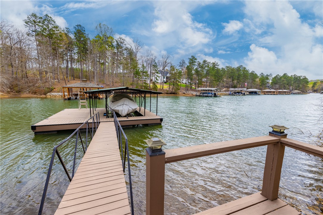 203 Little Lane Seneca, SC 29672 - Photo 37 of 48 This serene waterfront property offers direct lake access and a private boat dock.