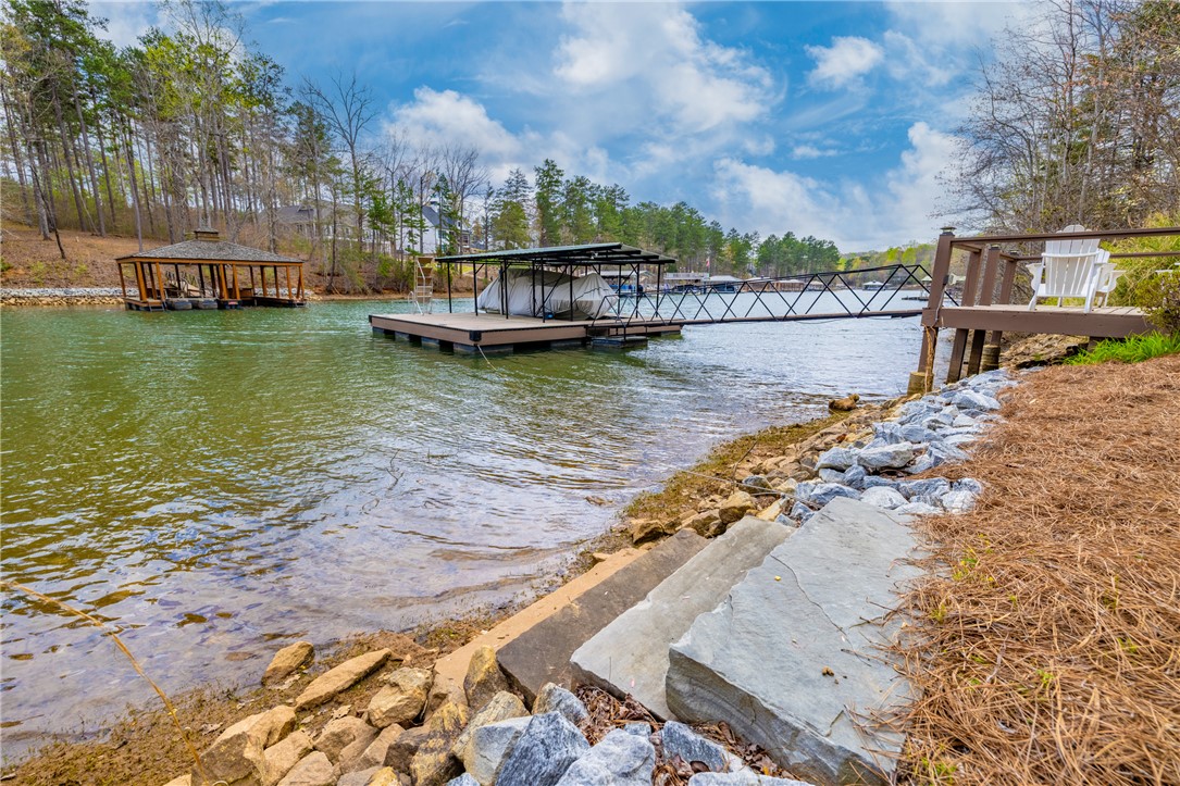 203 Little Lane Seneca, SC 29672 - Photo 39 of 48 This serene waterfront property offers direct lake access and private boat docks for endless aquatic enjoyment.