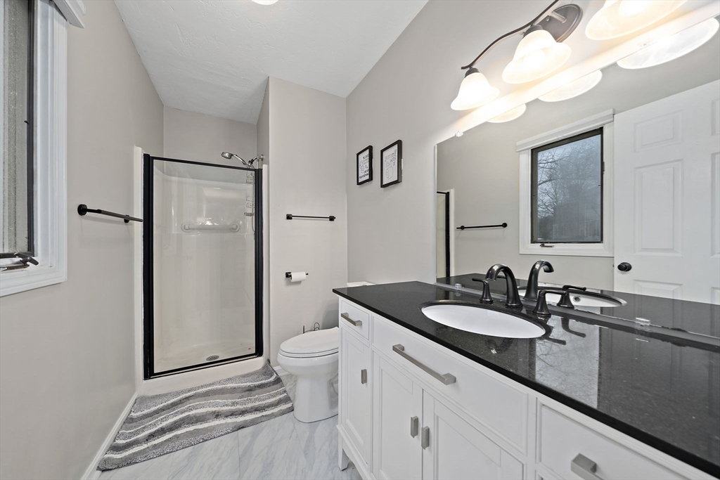 22 Union Square, Unit 22 Randolph, MA 02368 - Photo 20 of 28 a bathroom with a sink and a mirror