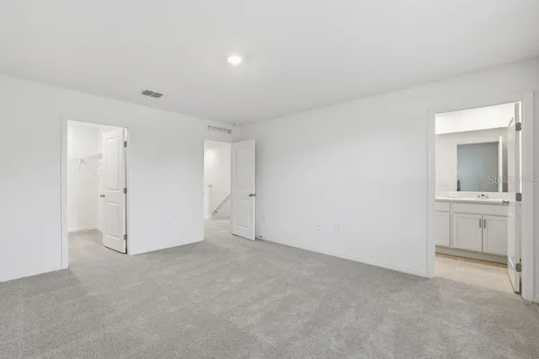 a bathroom with a toilet sink double and mirror