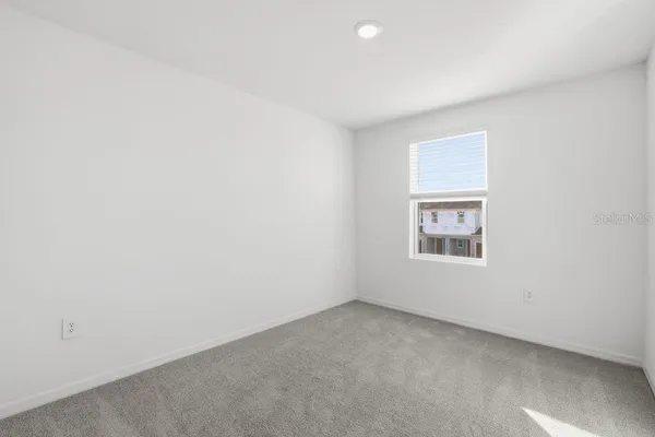 a white bath tub sitting next to a toilet
