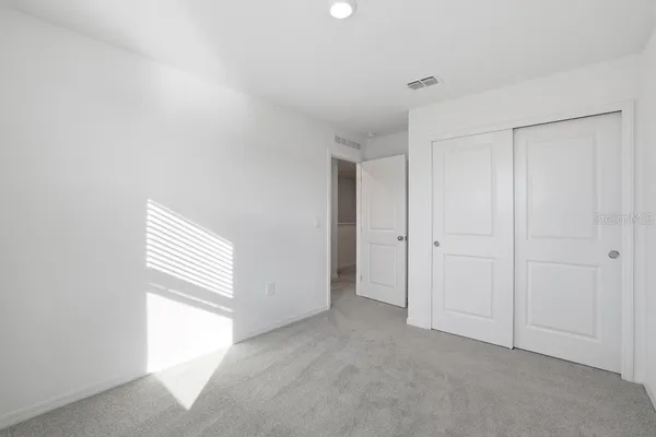 a view of a hallway with white walls