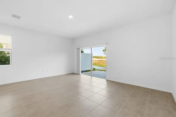 a view of a kitchen with a sink and a window