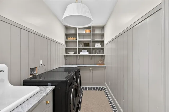 a kitchen with granite countertop a sink stove and cabinets