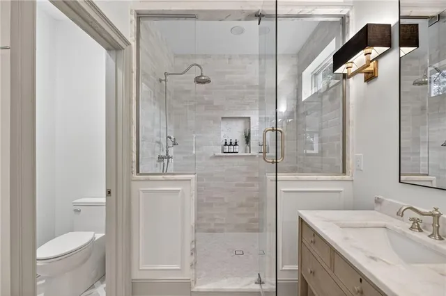 a white bath tub sitting in a bathroom