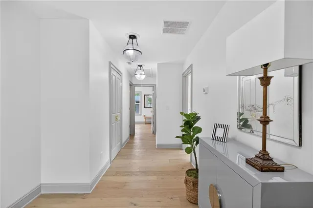 a bathroom with a double vanity sink toilet mirror and shower