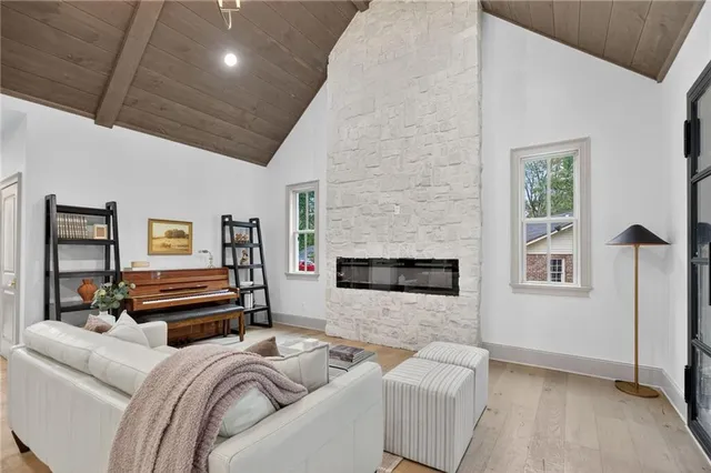 a bedroom with furniture and a fireplace