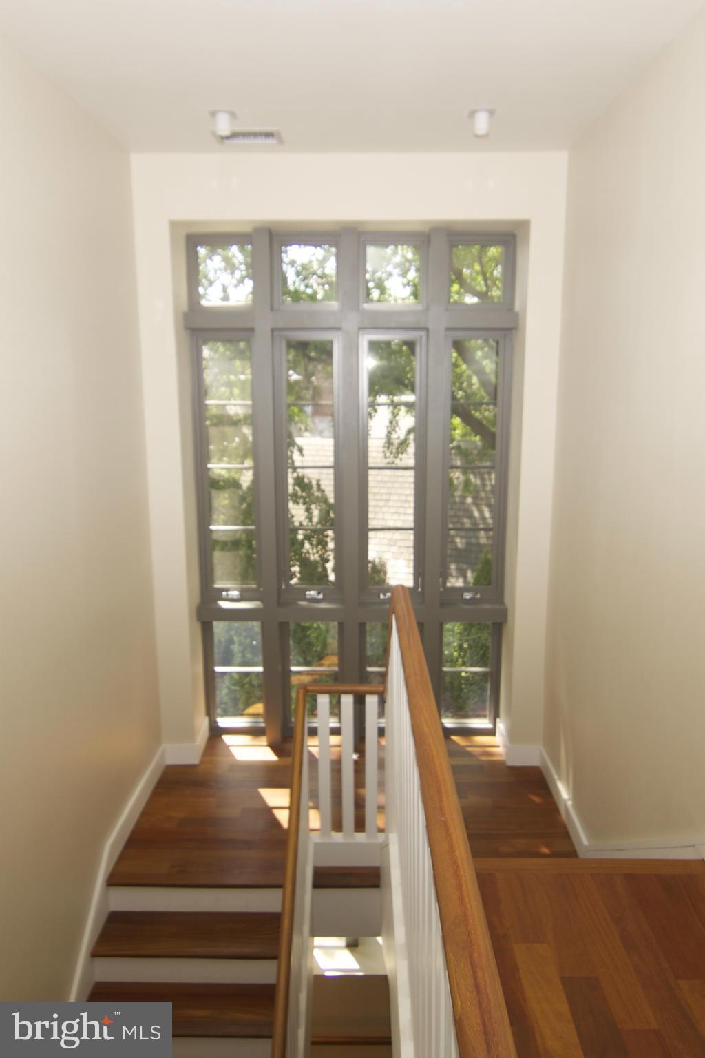 203 Lambeth Road Baltimore, MD 21218 - Photo 13 of 30 Custom Staircase with Palladian Window