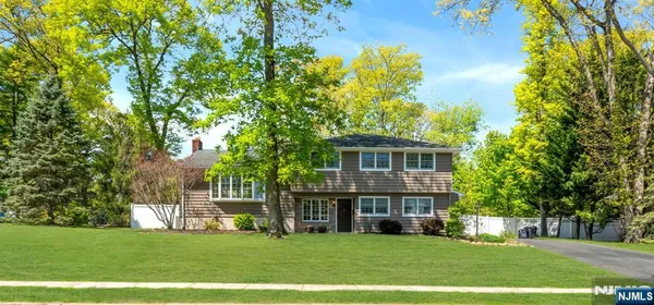 a view of a house with a big yard