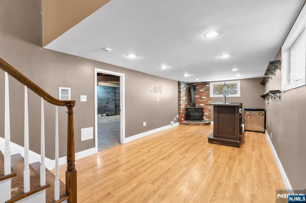 53 Smithfield Road Waldwick, NJ 07463 - Photo 13 of 48 a big room with wooden floor furniture and windows